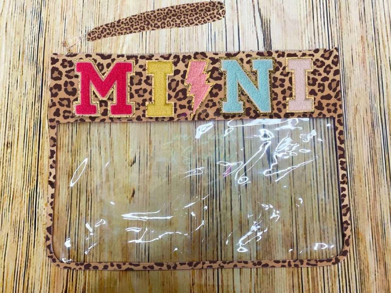 Leopard & clear bag with the word Mini on it.