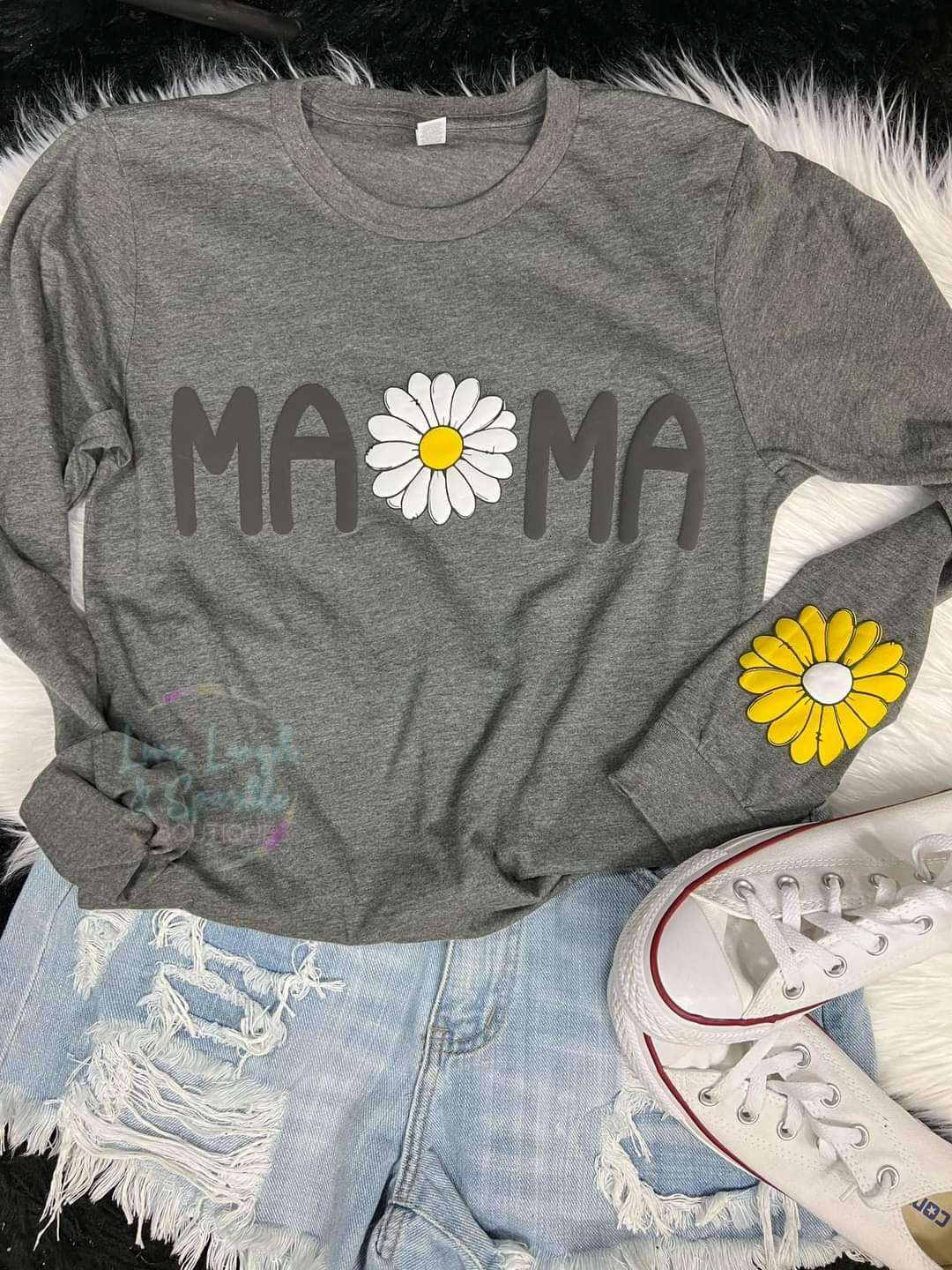 Gray long sleeve top with the word Mama on it and a white flower.  Also a yellow flower on the sleeve.