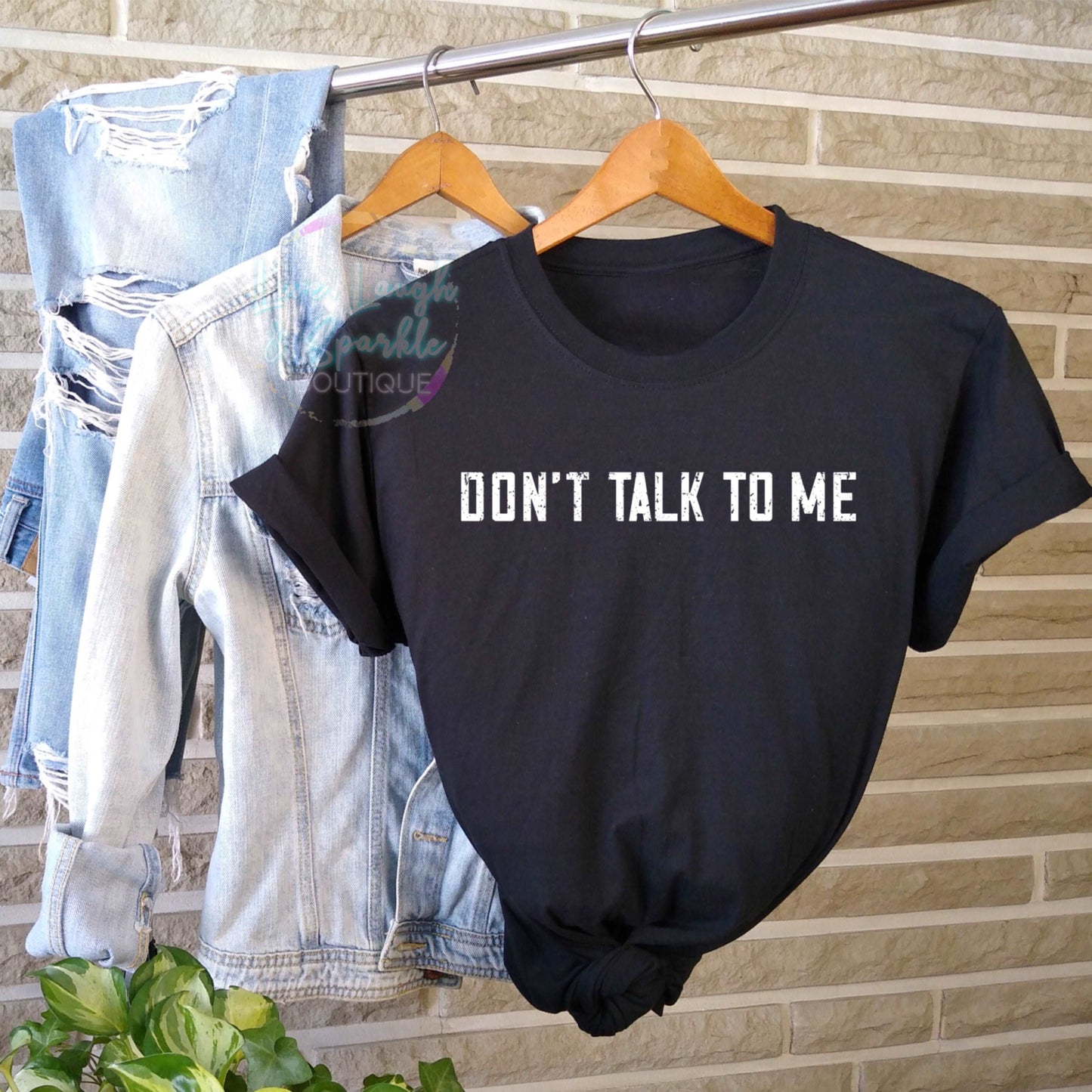 Black tee with Don' talk to me printed on it.