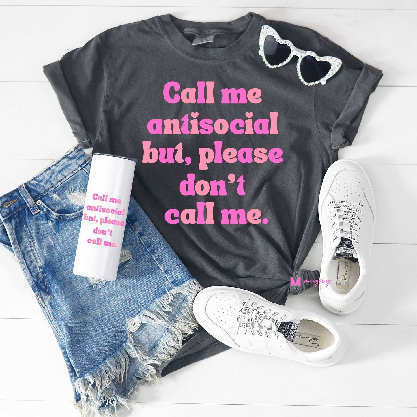 Gray tee with the words call me antisocial but please don't call me in pink letters.