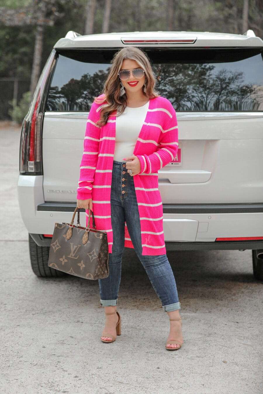 Knee-length hot pink with white stripes cardigan.