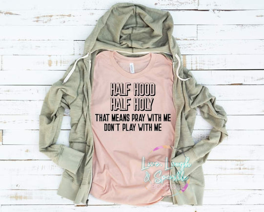 Light pink tee with the words half hood half holy that means pray with me don't play with me.
