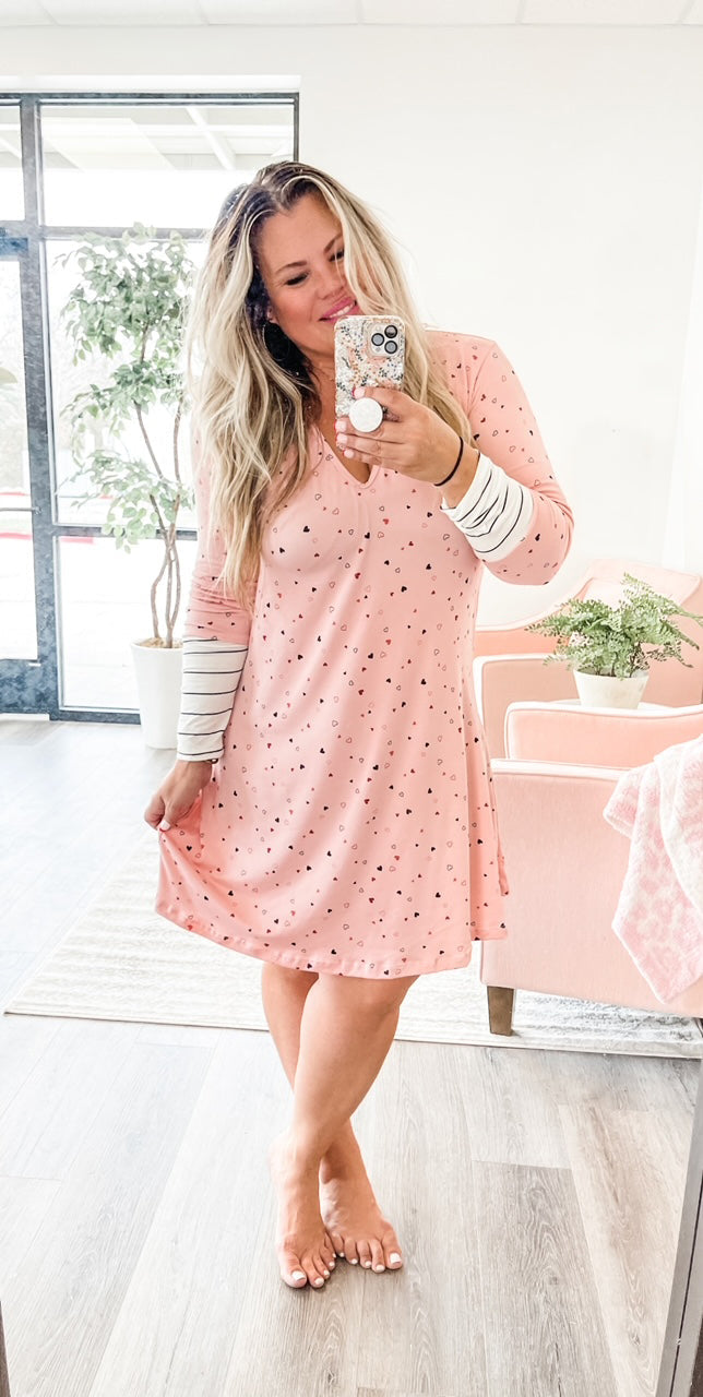 Long sleeve pajama gown with hearts and stripes on sleeves.
